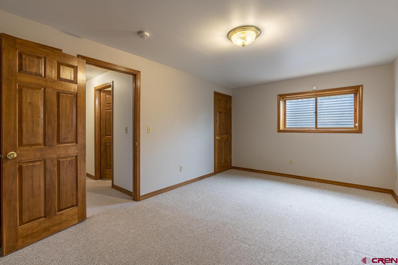 1403 Skyview Road Bayfield, CO 81122 - Photo 10 of 35 an empty room with windows & closet