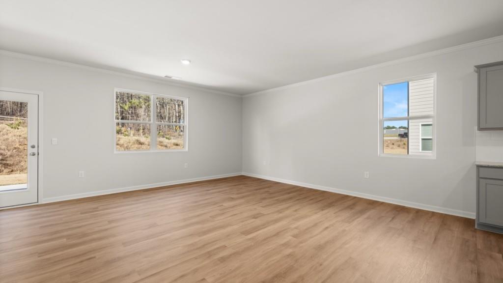2930 Daxton Lane Gainesville, GA 30507 - Photo 11 of 32 a view of an empty room with wooden floor and a window