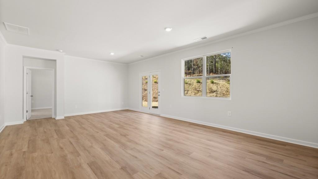 2930 Daxton Lane Gainesville, GA 30507 - Photo 13 of 32 a view of an empty room with wooden floor and a window