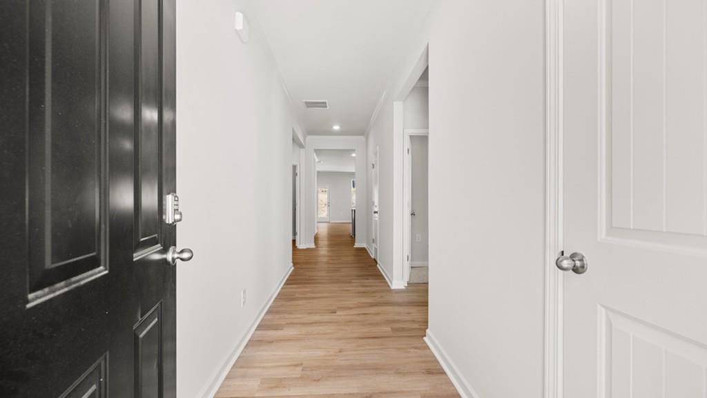 2930 Daxton Lane Gainesville, GA 30507 - Photo 2 of 32 a view of a hallway with wooden floor