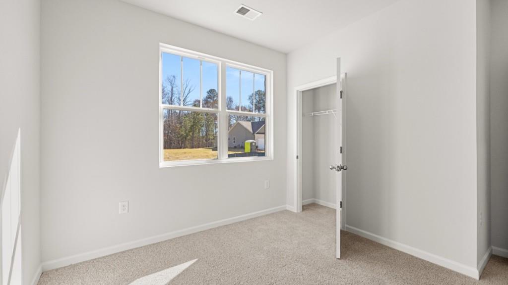 2930 Daxton Lane Gainesville, GA 30507 - Photo 22 of 32 a view of an empty room with windows and closet