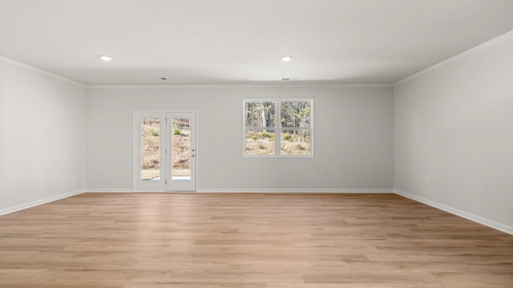 2930 Daxton Lane Gainesville, GA 30507 - Photo 10 of 32 an empty room with wooden floor and window