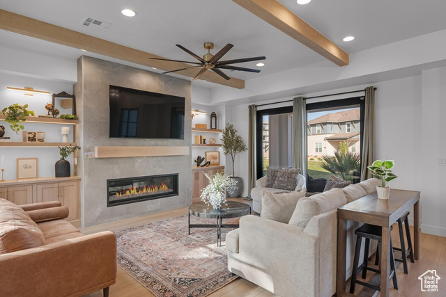 5367 Cyan Lane St. George, UT 84790 - Photo 2 of 36 Living area featuring a fireplace, wood finished floors, a ceiling fan, beam ceiling, and recessed lighting