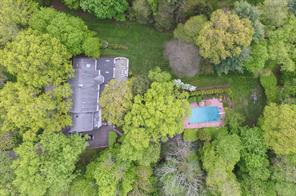 50 Pleasant Ridge Road Harrison, NY 10528 - Photo 1 of 1 an aerial view of a house with a yard