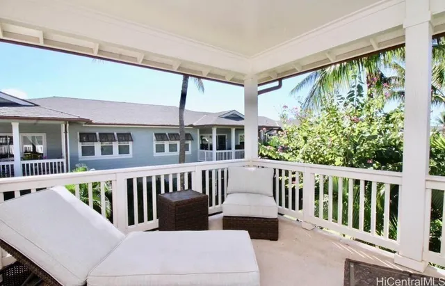 a view of a white house with a large window