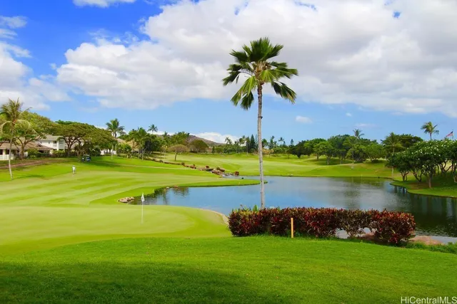 a view of a lake with houses in the back