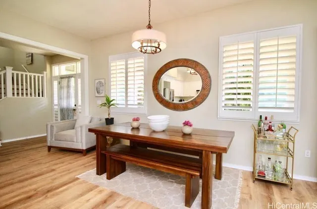 a work room with furniture and a wooden floor
