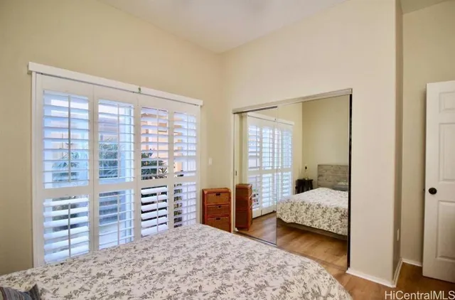 a bedroom with furniture and a window