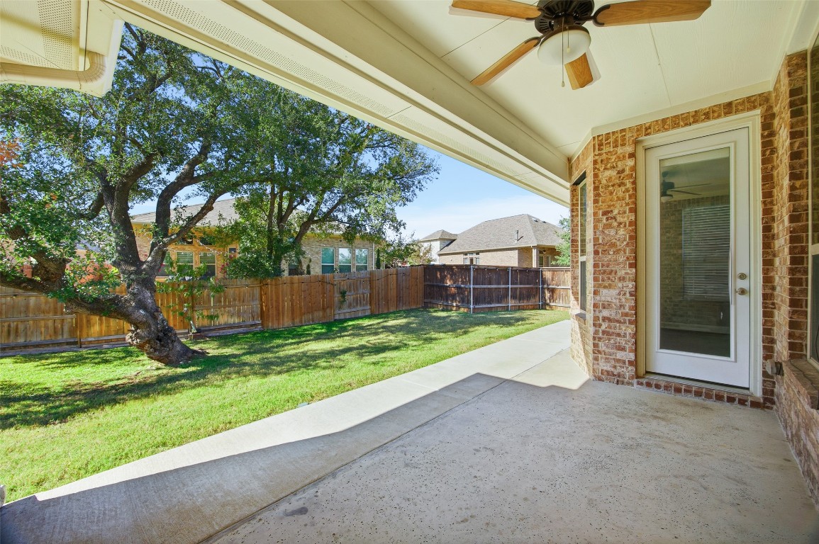 103 County Road 180, Unit 35 Leander, TX 78641 - Photo 28 of 31 Fenced backyard featuring a patio and ceiling fan