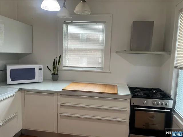 a kitchen with a stove and a microwave