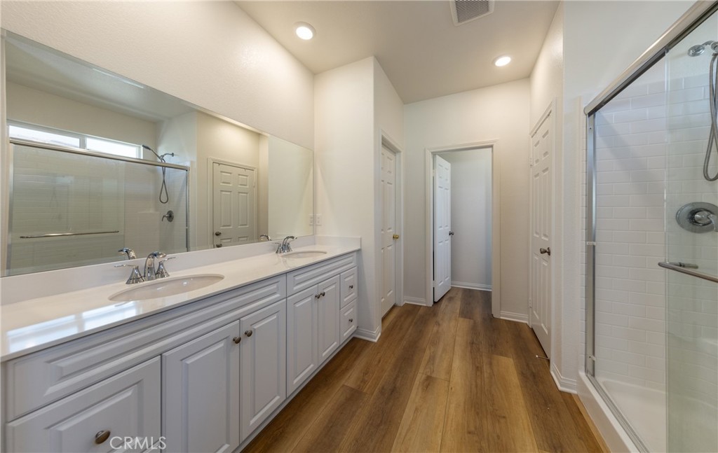 19778 Limon Court Riverside, CA 92507 - Photo 15 of 26 a spacious bathroom with a double vanity sink and mirror