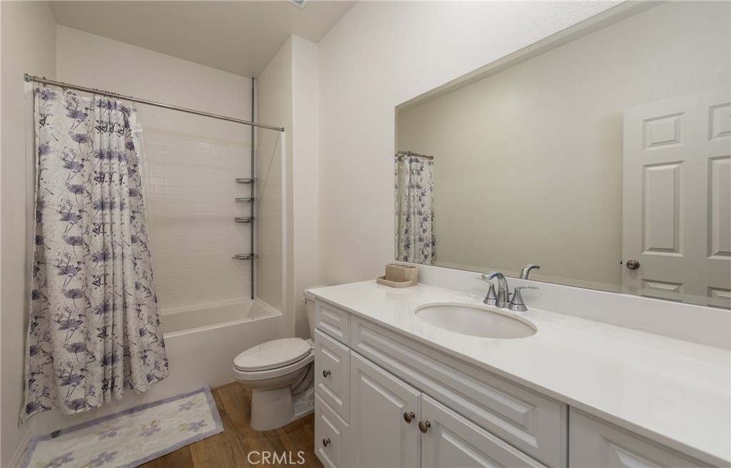 19778 Limon Court Riverside, CA 92507 - Photo 20 of 26 a bathroom with a sink toilet tub and shower