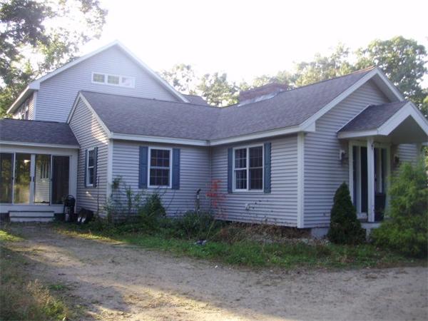 32 Acton Road Westford, MA 01886 - Photo 1 of 3 a front view of a house with garden