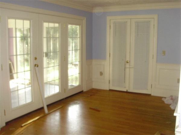 32 Acton Road Westford, MA 01886 - Photo 2 of 3 a view of an empty room with wooden floor and a window