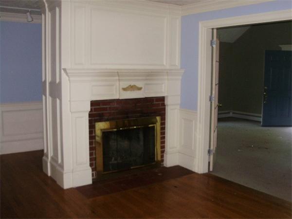 32 Acton Road Westford, MA 01886 - Photo 3 of 3 a living room with a fireplace