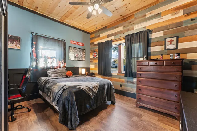 a bed room with a bed and a dresser