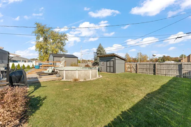 a view of a house with swimming pool and sitting area