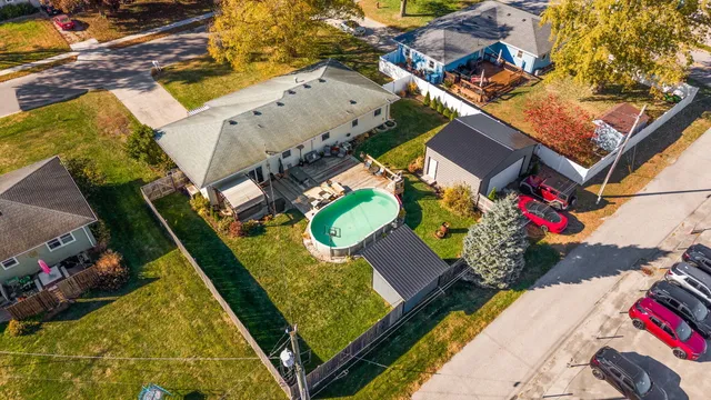 an aerial view of a house with a swimming pool