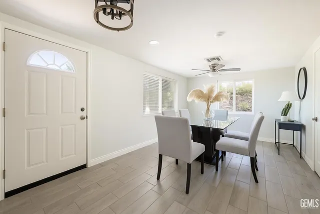 a dining room with furniture and window