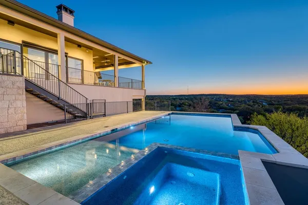 a view of a pool with a patio