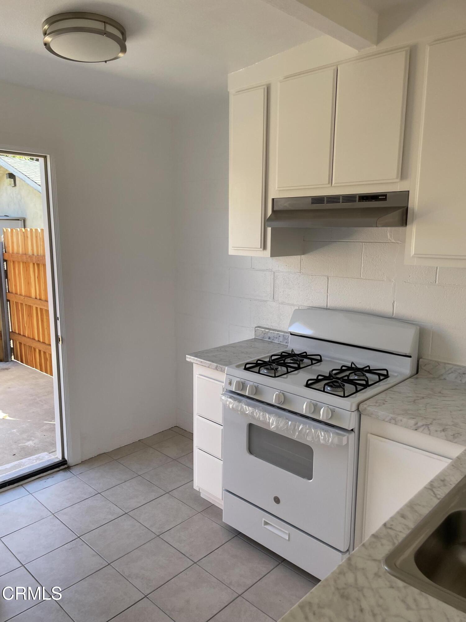 524 Anacapa Drive Camarillo, CA 93010 - Photo 2 of 9 a white stove top oven sitting inside of a kitchen