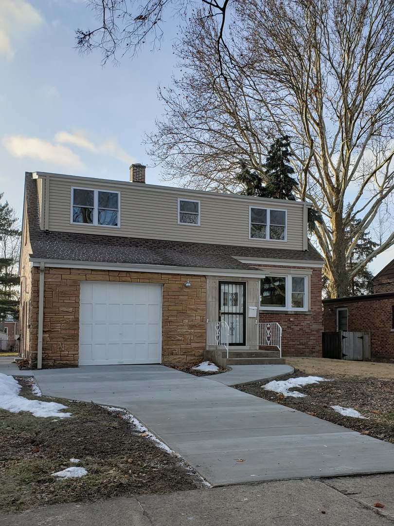 57 Northgate Road Riverside, IL 60546 - Photo 1 of 28 a front view of a house with a yard and garage