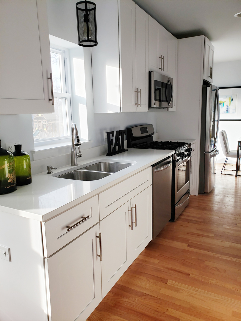 57 Northgate Road Riverside, IL 60546 - Photo 16 of 28 a kitchen with white cabinets and appliances