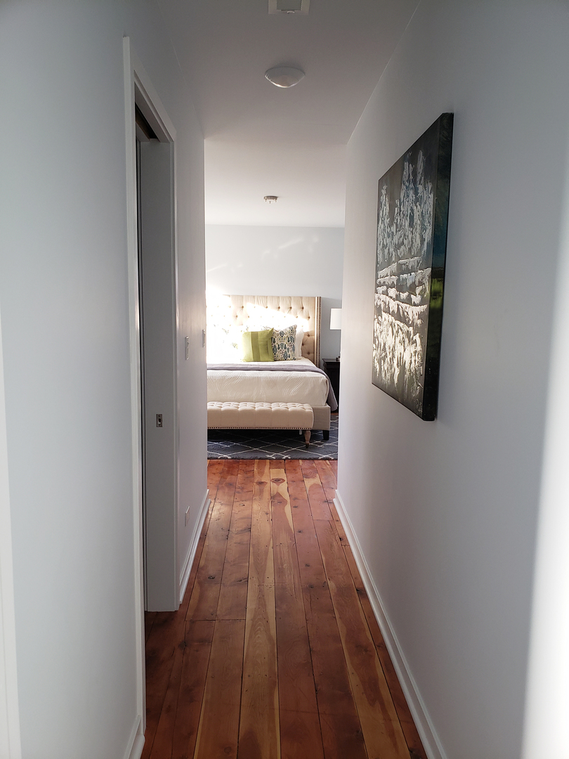 57 Northgate Road Riverside, IL 60546 - Photo 27 of 28 a view of a room with wooden floor windows and chandelier