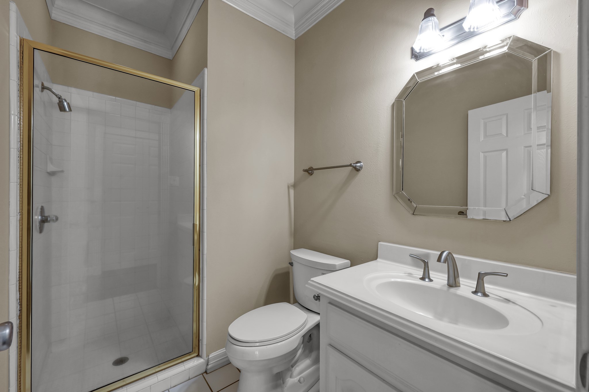 2205 Longmire Road Conroe, TX 77304 - Photo 19 of 49 Full bathroom downstairs is located through the office/flex space door.