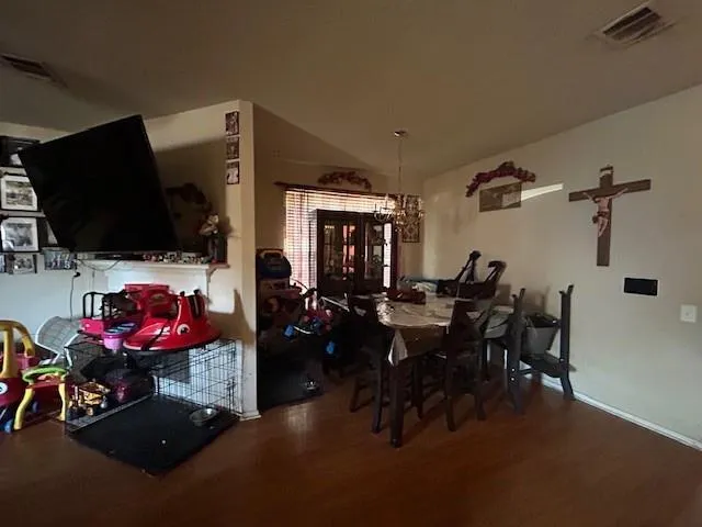 a view of a livingroom with furniture and a flat screen tv