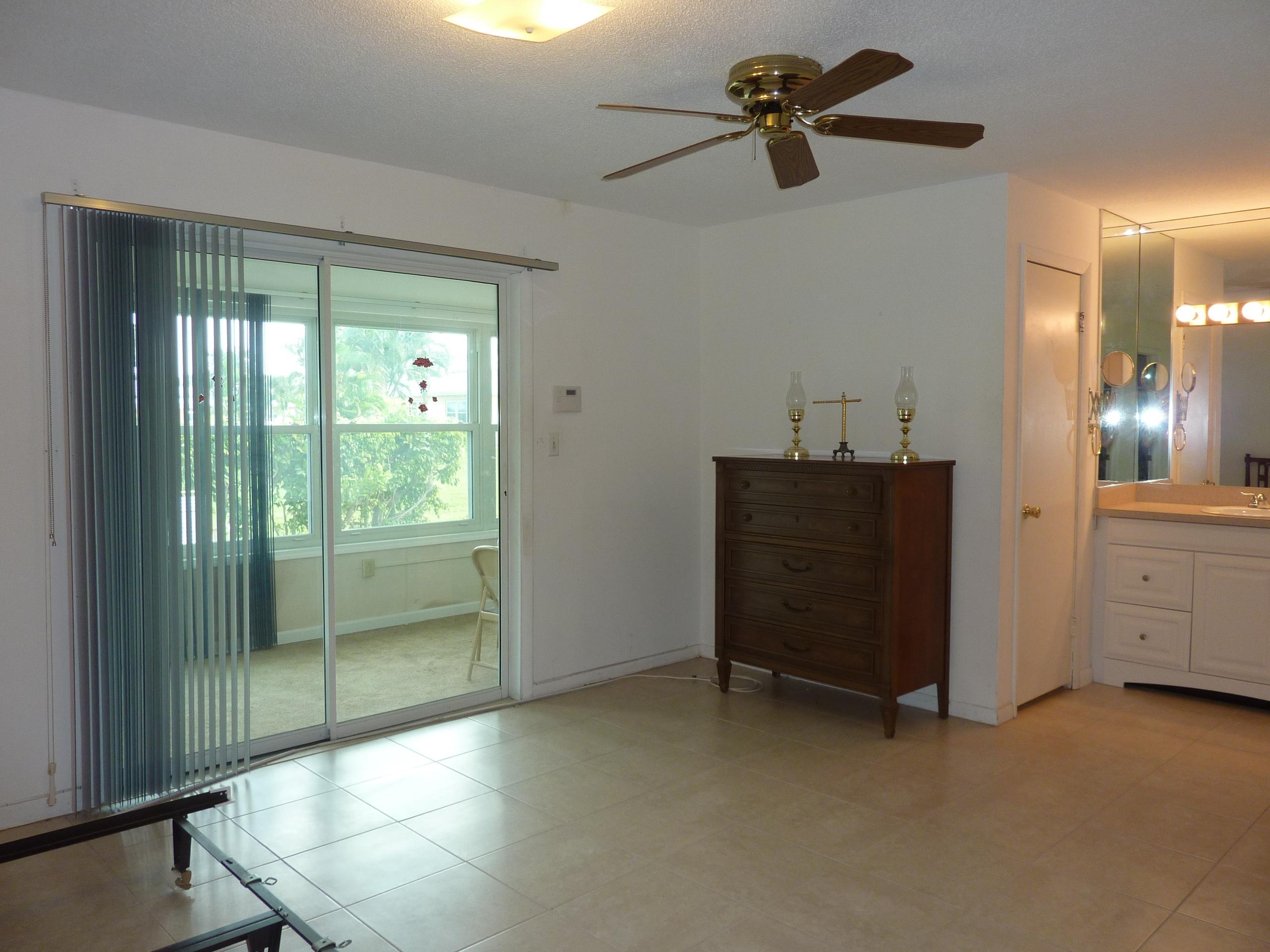 170 North High Point, Unit C Boynton Beach, FL 33435 - Photo 16 of 37 Bedroom view into Florida Room