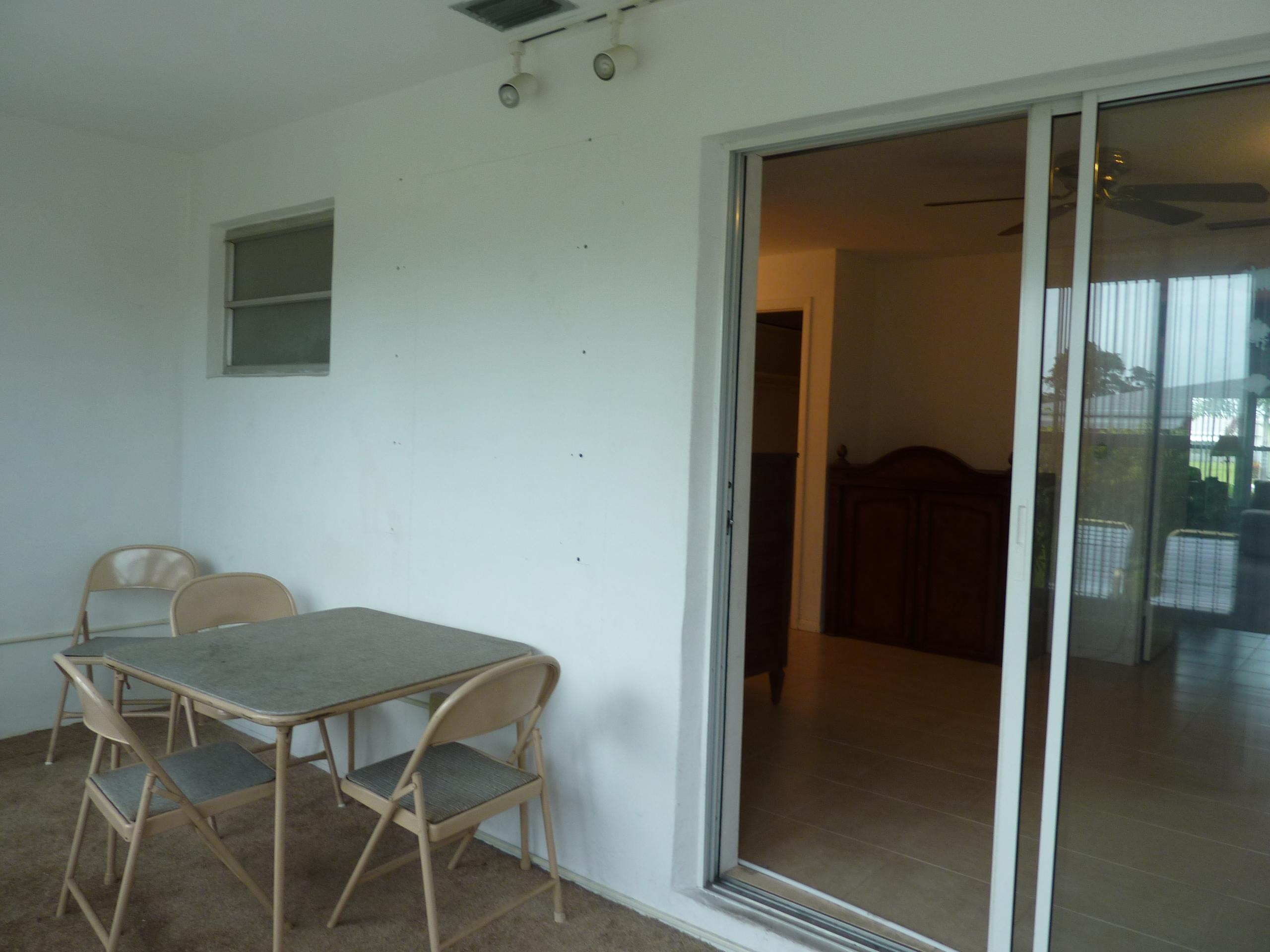 170 North High Point, Unit C Boynton Beach, FL 33435 - Photo 20 of 37 Florida Room looking into bedroom