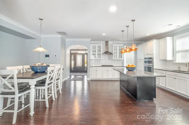 a view of a dining area with furniture window and wooden floor