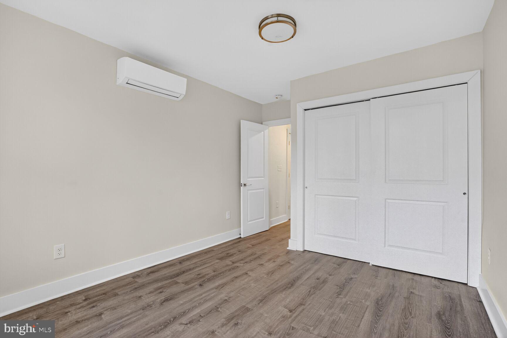 1821 T Street Northwest Washington, DC 20009 - Photo 36 of 40 an empty room with wooden floor and window