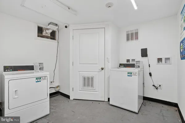 a view of storage and utility room with washer and dryer