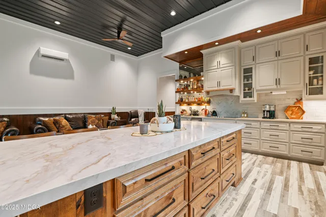 a view of a patio with table and chairs and potted plants