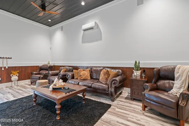 a view of a balcony with chairs and a stove