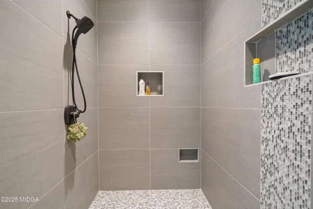 a view of a lush green forest with lots of trees