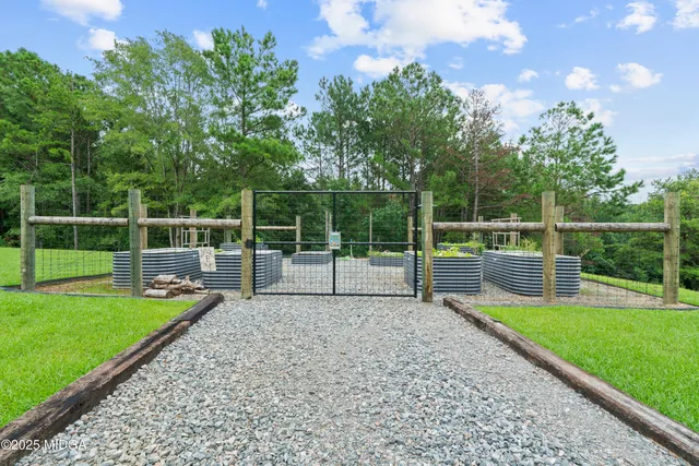a view of a swimming pool with a yard
