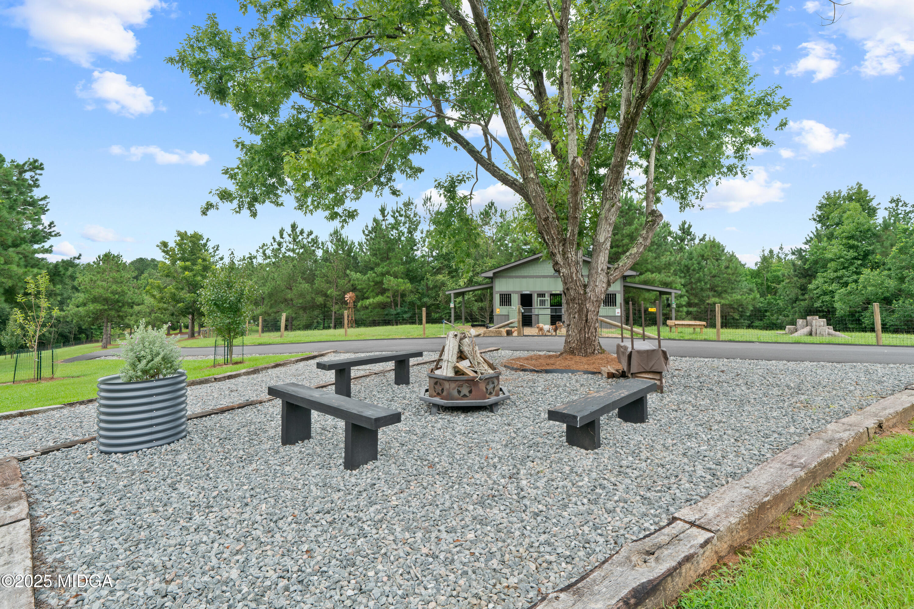 1971 Highway 49 Gray, GA 31032 - Photo 6 of 98 a view of a backyard with lawn chairs and a fire pit