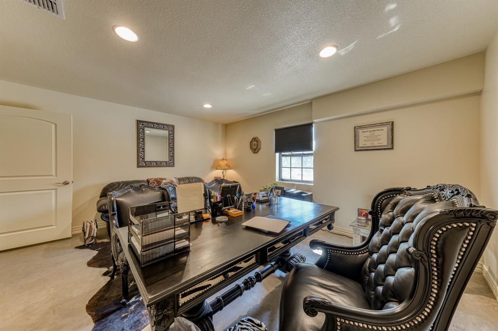 2337 Walsh Road Olney, TX 76374 - Photo 35 of 38 Spacious room featuring recessed lighting, a window with a blackout shade, a white paneled door, and light-toned walls