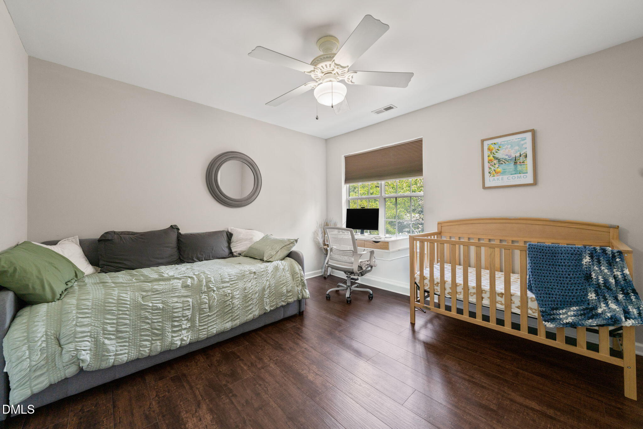 4323 Pine Springs Court Raleigh, NC 27613 - Photo 21 of 38 a bedroom with a bed and window