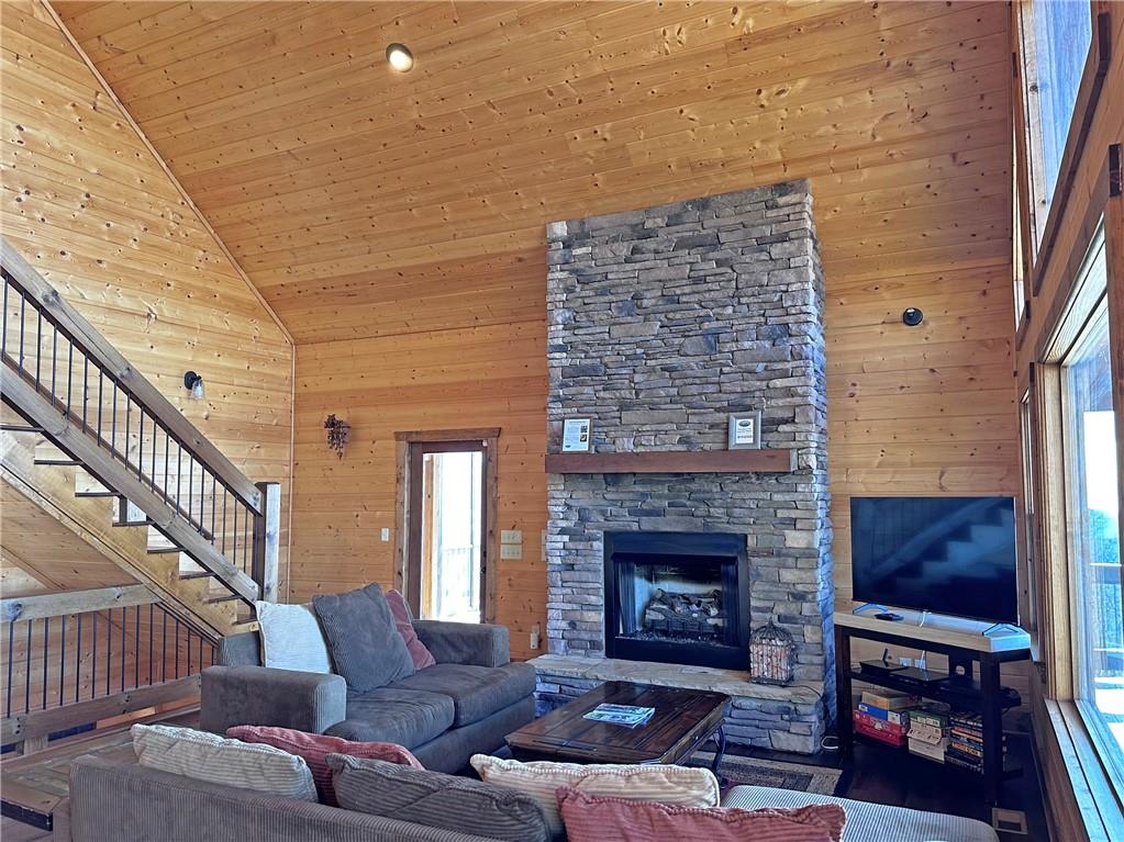 2175 Andes Ridge Talking Rock, GA 30175 - Photo 17 of 51 a living room with furniture a fireplace and a flat screen tv