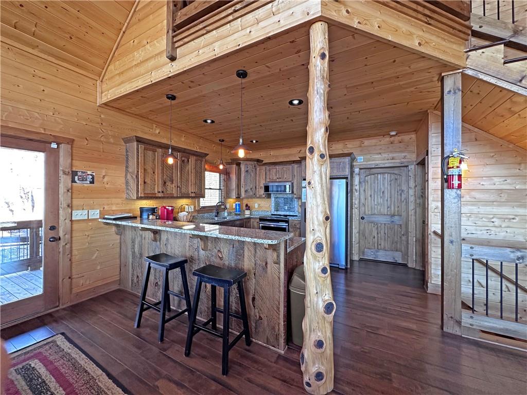 2175 Andes Ridge Talking Rock, GA 30175 - Photo 24 of 51 a kitchen with stainless steel appliances a dining table chairs and wooden floor