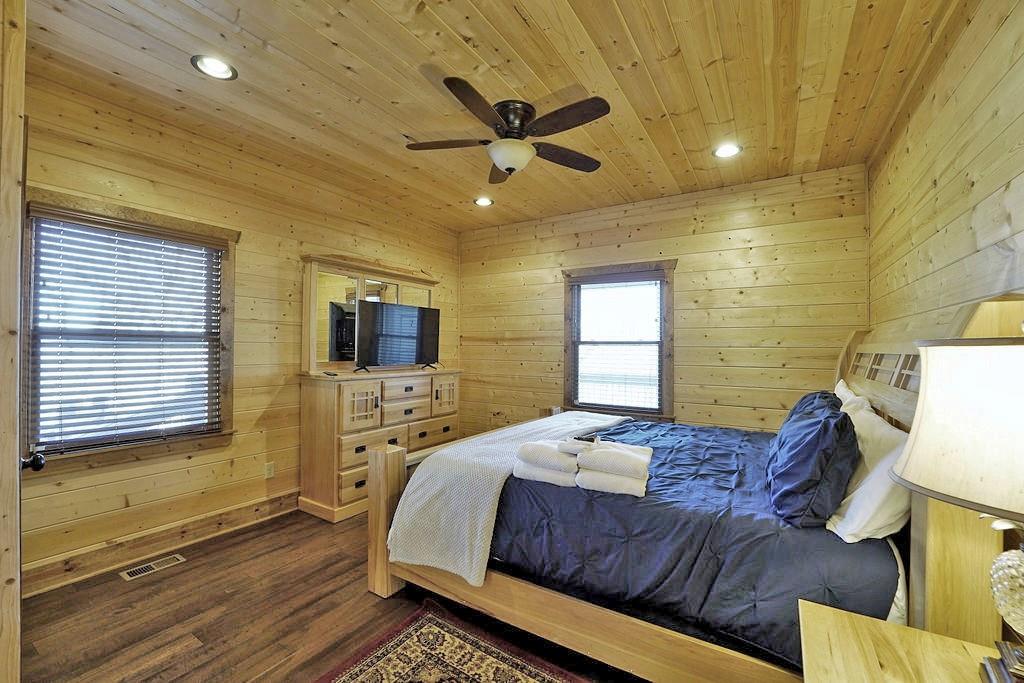 2175 Andes Ridge Talking Rock, GA 30175 - Photo 27 of 51 a bedroom with a bed and wooden floor