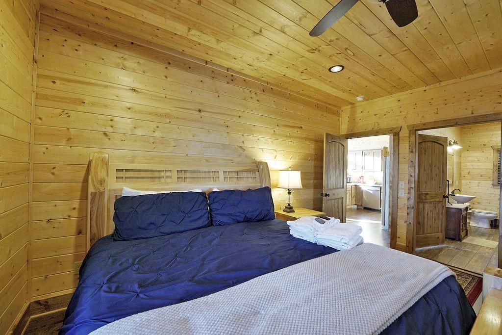 2175 Andes Ridge Talking Rock, GA 30175 - Photo 28 of 51 a bedroom with a bed and wooden floor