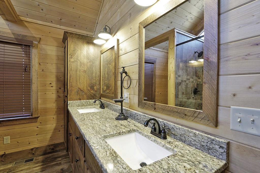 2175 Andes Ridge Talking Rock, GA 30175 - Photo 36 of 51 a bathroom with a granite countertop sink and a mirror