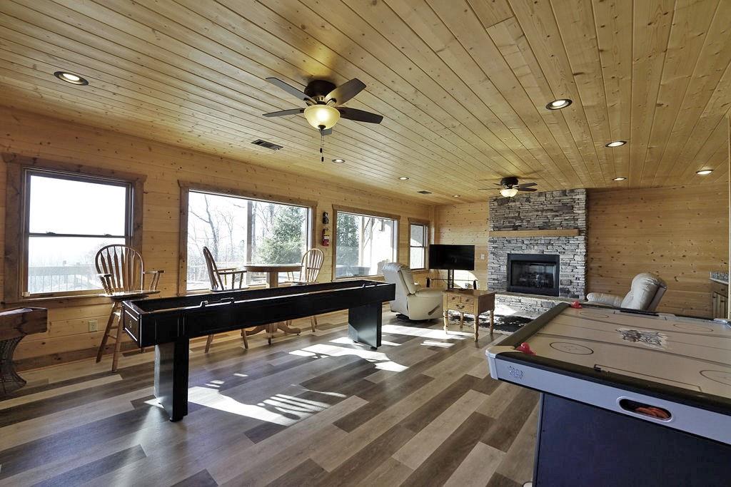 2175 Andes Ridge Talking Rock, GA 30175 - Photo 38 of 51 a living room with furniture a fireplace and a table