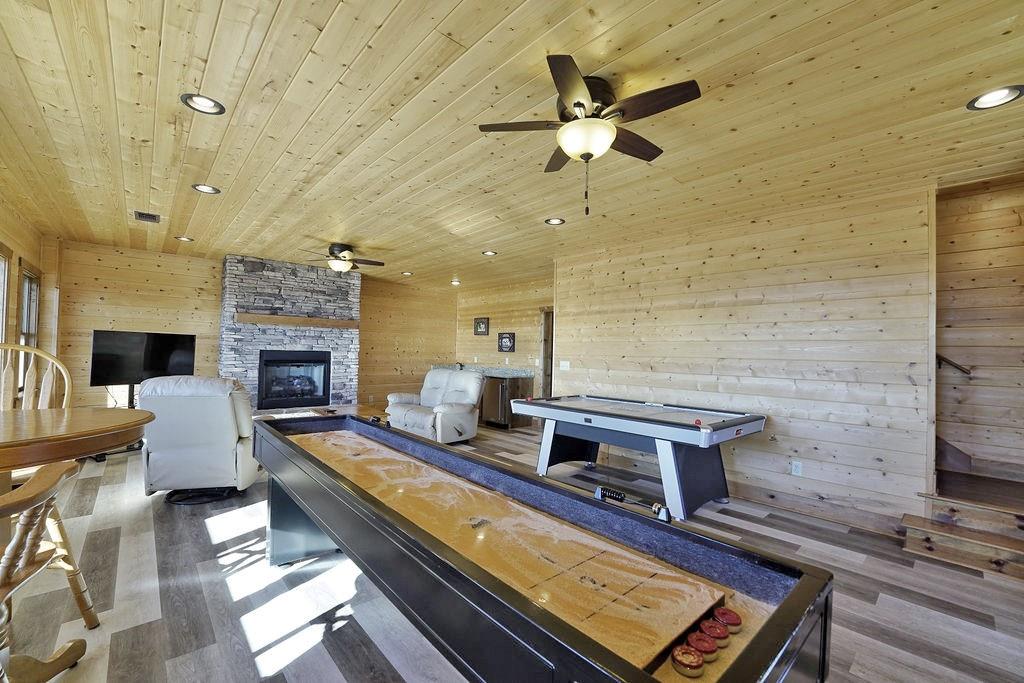 2175 Andes Ridge Talking Rock, GA 30175 - Photo 39 of 51 a living room with furniture pool table and a fireplace