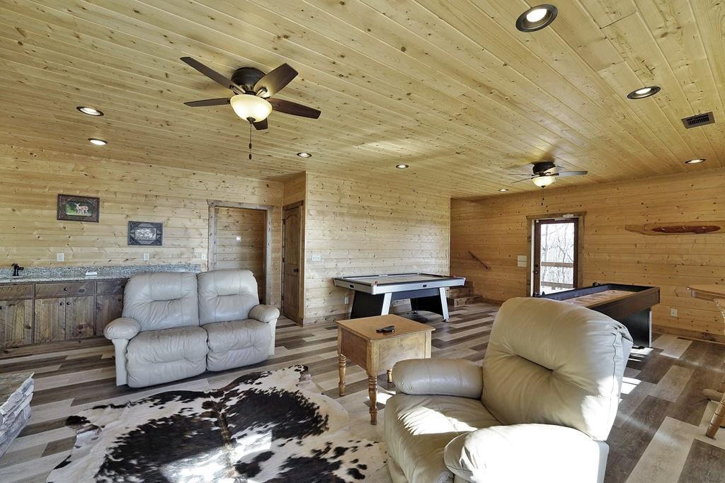2175 Andes Ridge Talking Rock, GA 30175 - Photo 40 of 51 a living room with furniture and a chandelier